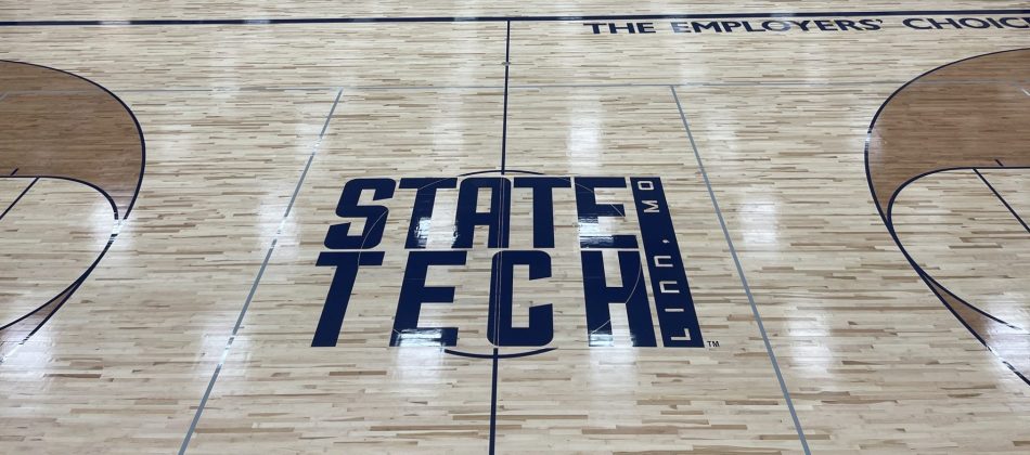State Tech logo on the basketball court