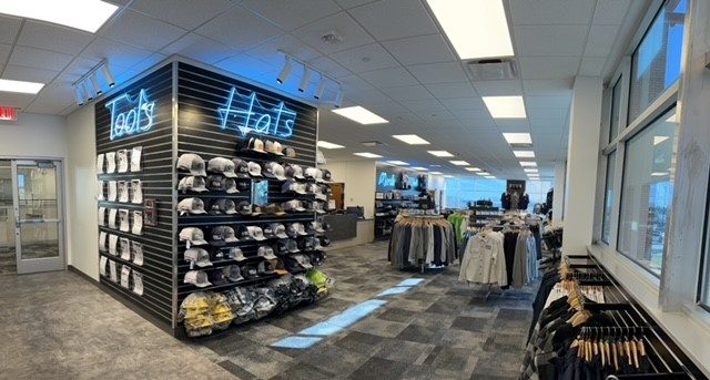 hats on a rack inside a store